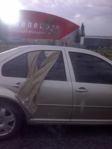 Pants hanging out of car window.jpg