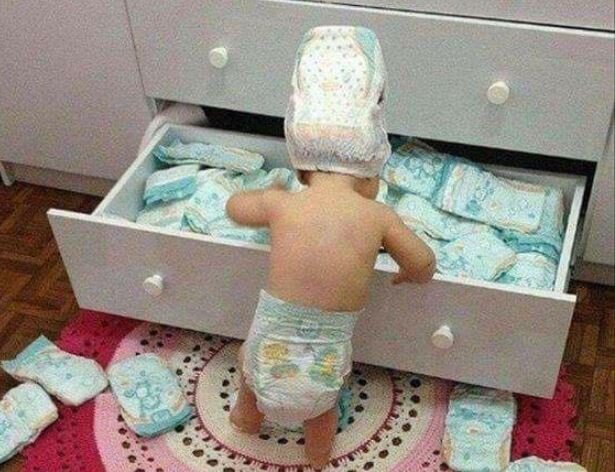 Child looking in drawer.JPG