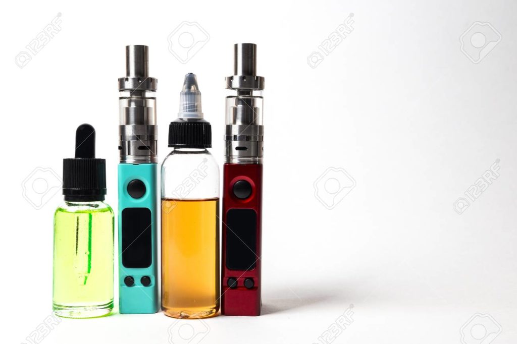 98113708-e-liquid-e-juice-in-the-bottles-and-e-cigarette-vape-isolated-on-the-white-background-with-copyspace-1024x682.jpg